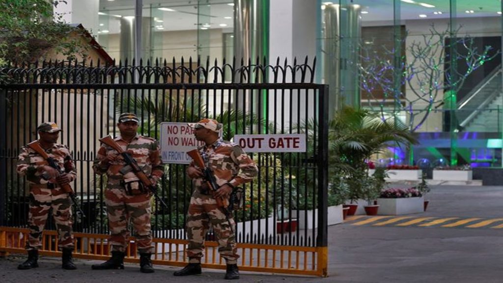 Members of the Indo-Tibetan Border Police (ITBP) stand guard outside a building housing BBC offices, where income tax officials are conducting a search for a second day, in New Delhi, India, February 15, 2023. REUTERS/Altaf Hussain.