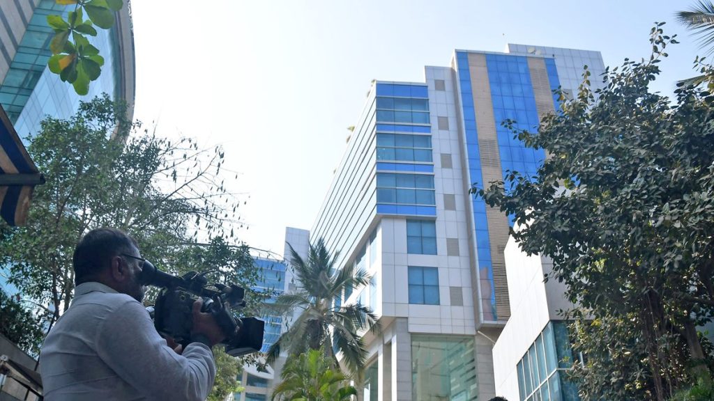 Media persons stand outside the BBC office where the survey is being conducted by Income Tax officials, in Mumbai on Tuesday. (ANI Photo)

