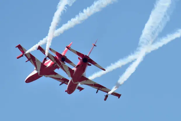Indian Air Force's aerobatic team Suryakiran perform maneuvers on the second day of the Aero India 2023 at Yelahanka air base in Bengaluru, India, Tuesday, Feb. 14, 2023. Aero India is a biennial event with flying demonstrations by stunt teams and militaries and commercial pavilions where aviation companies display their products and technology. (AP Photo/Aijaz Rahi)