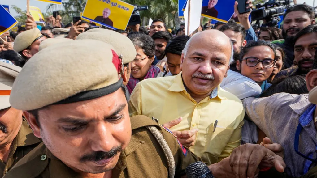Delhi Police personnel escort Delhi Deputy Chief Minister Manish Sisodia from Rajghat ahead of his questioning by CBI in the liquor policy case, in New Delhi, Sunday, Feb. 26, 2023. (PTI Photo/Manvender Vashist Lav)

