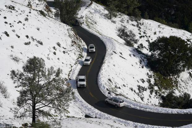 Motorists makes their way up Summit Road at Mount Diablo State Park in Walnut Creek, Calif., Monday, Feb. 27, 2023. In California, the National Weather Service said a series of winter storm systems will continue moving into the state through Wednesday after residents got a brief break from severe weather Sunday. (AP Photo/Godofredo A. Vásquez)