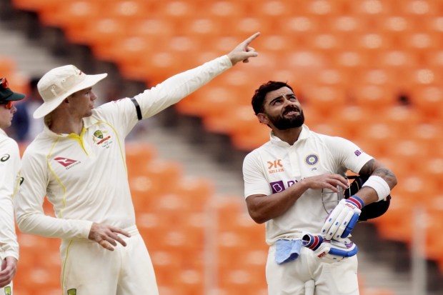 Indian batter Virat Kohli and Australian player Peter Handscomb during the 4th day of the fourth test cricket match between India and Australia. (Photo: PTI)
