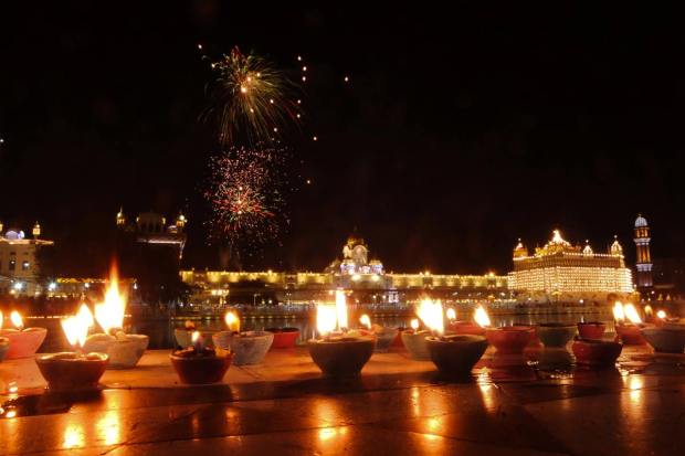 Amritsar: Fireworks at the illuminated Golden Temple during the birth anniversary celebrations of the ninth Sikh Guru, Guru Tegh Bahadur, in Amritsar, Tuesday, April 11, 2023. (PTI Photo)(PTI04_11_2023_000317A)