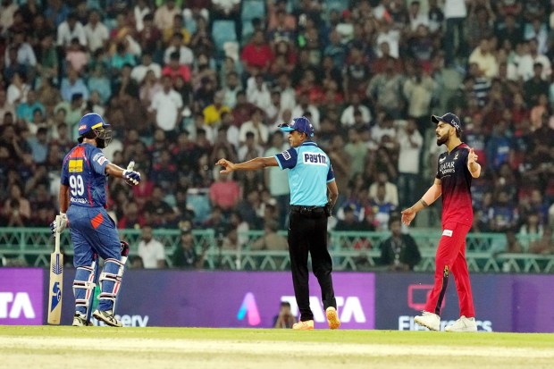 Lucknow Super Giants batter Amit Mishra and Royal Challengers Bangalore player Virat Kohli during the IPL 2023 cricket match between Lucknow Super Giants and Royal Challengers Bangalore in Lucknow on Monday. (Photo: PTI)
