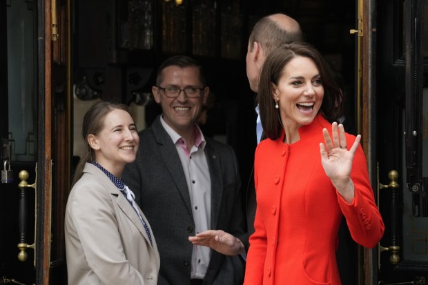Kate, Princess of Wales waves to the public as leave the Dog and Duck pub while she views Coronation preparations in the Soho area of central London in London, Thursday. (Photo: AP)