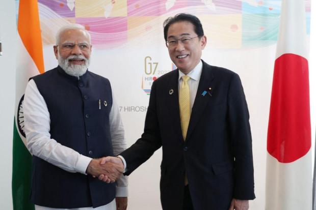 PM Narendra Modi met and held discussion with his Japanese counterpart Fumio Kishida. (Image/Twitter)