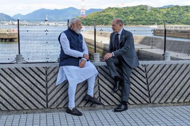 Prime Minister Narendra Modi chatting with Chancellor of Germany Olaf Scholz on the sidelines of G7 Summit. (Image/Twitter)