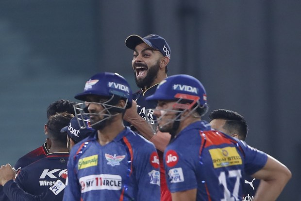 Royal Challengers Bangalore's Virat Kohli celebrates the wicket of Lucknow Super Giants' Deepak Hooda during the Indian Premier League (IPL) match between Lucknow Super Giants and Royal Challengers Bangalore in Lucknow. (Photo: AP)