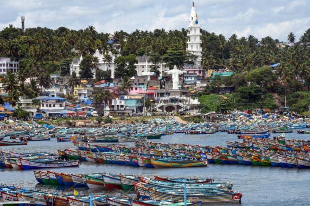 Fishing boats anchored on the shore at the Vizhinjam harbour due to alert for Cyclone Biparjoy, in Thiruvananthapuram.