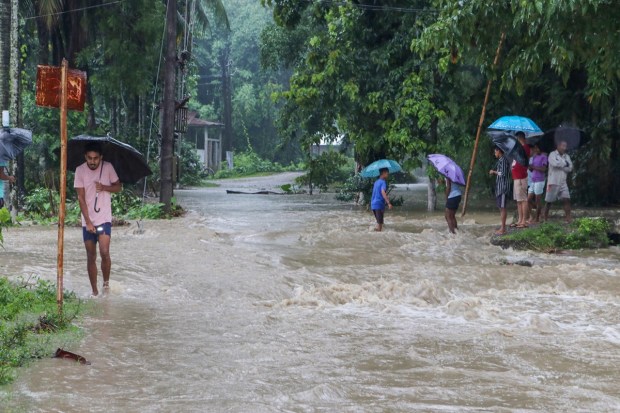 Baksa: Citizens wade through floodwater at Bagribari, in Baksa district, Thursday, June 15, 2023. (PTI Photo)