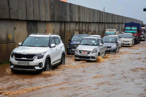 Guwahati: Vehicles wade through the waterlogged National Highway 27 after rainfall, at Boragaon in Guwahati, Saturday, June 17, 2023. (PTI Photo)