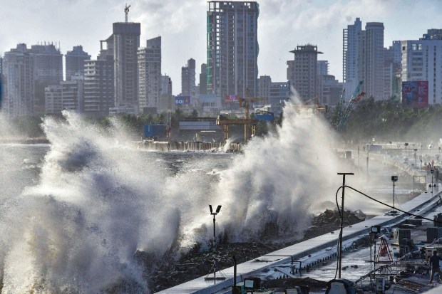 High waves are seen at Mumbai's waterfront during high tide due to the formation of Cyclone Biporjoy. (PTI Photo)