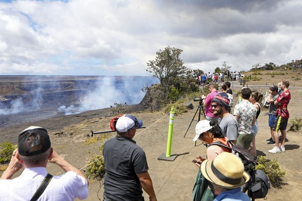 Visitors view the Kilauea eruption in Hawaii on Wednesday, June 7, 2023. It's one of the world's most active volcanoes and began erupting after a three-month pause. (Photo: AP)