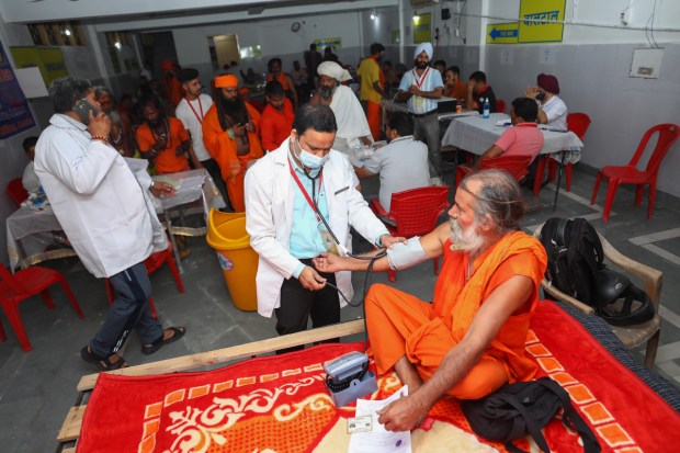 A sadhu being examined by the paramedical staff at Ram Mandir Amarnath Yatra base camp, in Jammu on June 30. (Image: PTI)