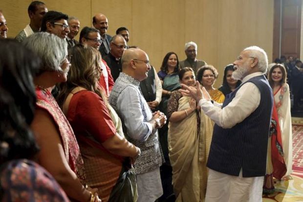 Prime Minister Narendra Modi interacts with members of the Indian Community, in Cairo, Saturday. (PTI Photo)