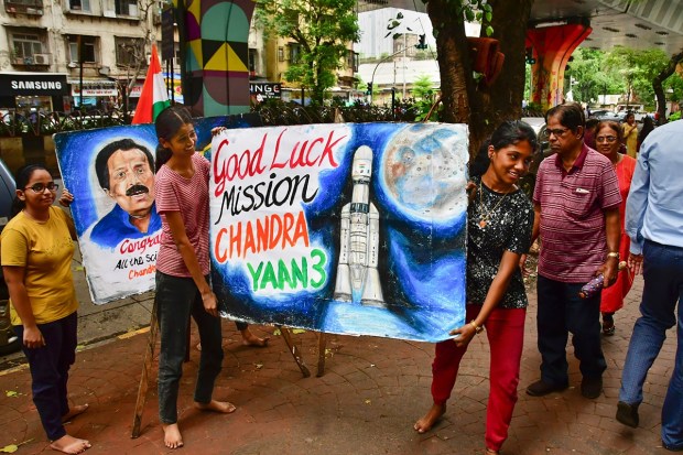 Students of the Gurukul School of Arts create paintings to wish good luck to ISRO scientists in Mumbai. (PTI Photo)