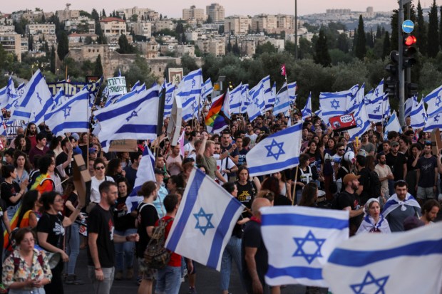 Mass protests broke out in Israel on Tuesday after the parliamentary coalition gave initial approval to the bill which would limit the Supreme Court's oversight powers. (Image: Reuters)
