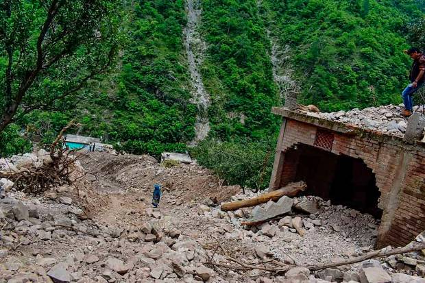 Damages roads and bridge after flood following the recent heavy monsoon rains, in Nainital. (PTI Photo)
