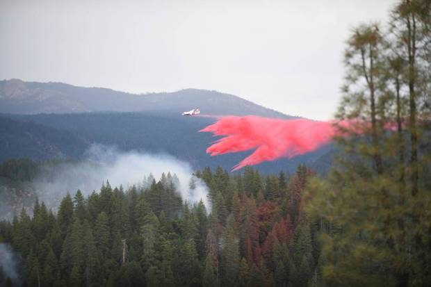 A tanker makes a retardant drop on the Highway Fire near Washington, California. (AP)