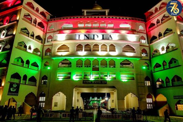 The gate at the Attari Wagha border illuminated in the colours of the national flag on Independence Day, in Attari. (PTI Photo)