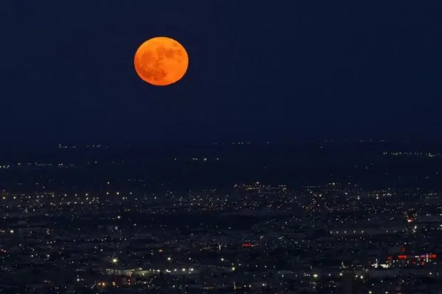 A Super Blue Moon rises above Ciudad Juarez, Mexico. A Blue Moon is usually classified as the second full moon which occurs in a single calendar month, according to NASA. (REUTERS)