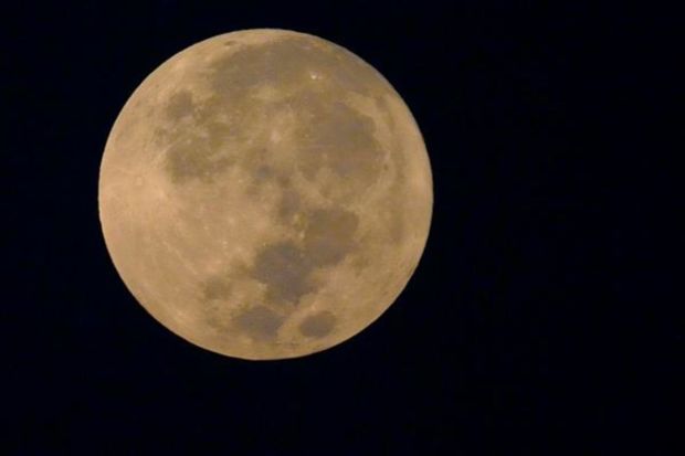 A super moon is seen over Kolkata's skyline, India, Thursday, Aug. 31, 2023. The cosmic curtain rose Wednesday night with the second full moon of the month, also known as a blue moon. A little bigger and brighter thanks to its slightly closer position to Earth. (AP Photo/Bikas Das)