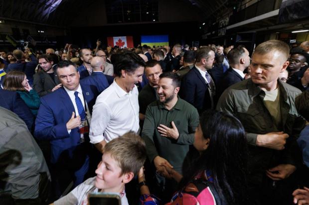 Volodymyr Zelenskiy, Ukraine's president, center right, and Justin Trudeau, Canada's prime minister, center left, greet supporters at an event in Toronto.
