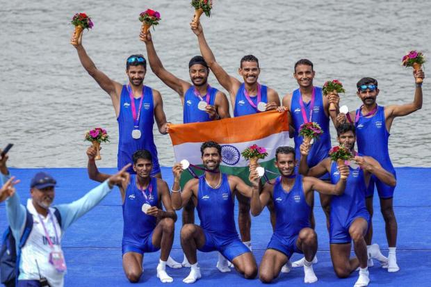 India’s Neeraj, Naresh Kalwaniya, Neetish Kumar, Charanjeet Singh, Jaswinder Singh, Bheem Singh, Punit Kumar and Ashish celebrate at the podium after winning silver medal in Men’s Coxed Eight event at the 19th Asian Games, in Hangzhou, China. (Image/PTI)