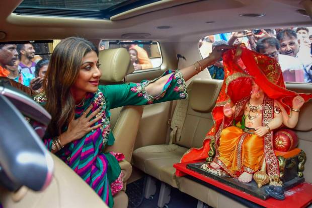 Bollywood actor Shilpa Shetty carries a Ganesh idol from a workshop ahead of Ganesh Chaturthi, in Mumbai. (PTI Photo)