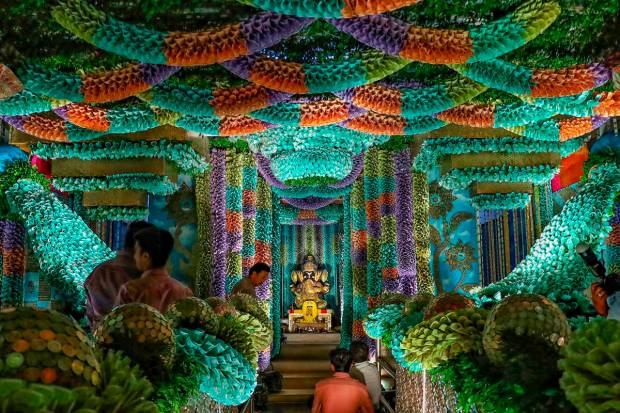 Sri Sathya Sai Ganapathy temple decorated with fifty lakhs coins and more than one crore currency notes on the occasion of Ganesha Chaturthi festival at J.P. Nagar, in Bengaluru. (PTI Photo)