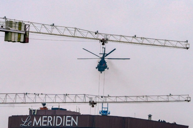 An Indian Air Force (IAF) helicopter during a security drill atop Le Meridien ahead of the G20 Summit. (Image: PTI)