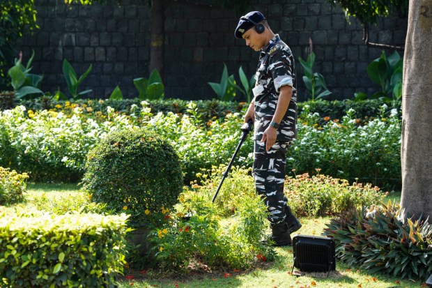 A security official during security check at ITC Maurya for the upcoming G20 Summit. (Image: PTI)