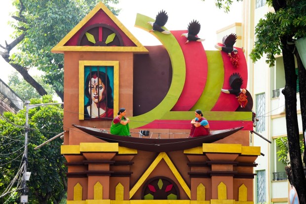 A community 'puja pandal' themed on 'surrogacy' during Durga Puja festival in Kolkata. (PTI Photo)