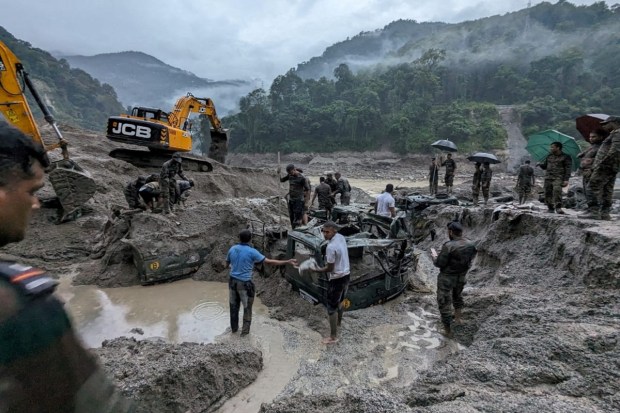 Of the 23 army personnel who were missing from Burdang area, the bodies of seven have been recovered from different areas downstream while one was rescued and the search is on for 15 missing jawans. (Reuters Photo)