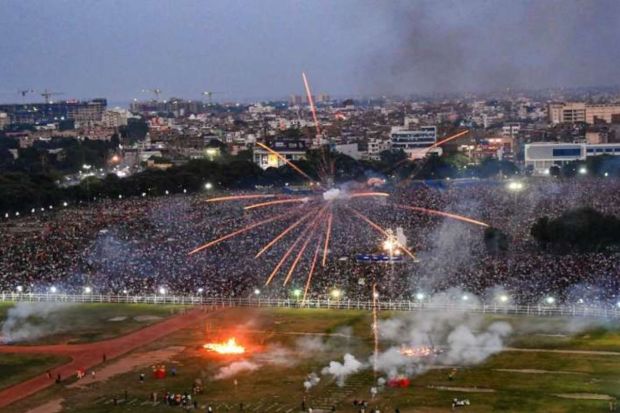 People watch firecrackers show during Dussehra celebrations at Gandhi Maidan in Patna. (Photo: PTI)