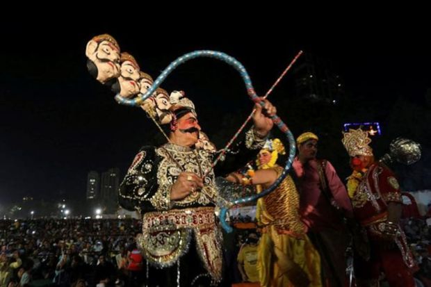 Artists perform Ramlila, a re-enactment of the life of Hindu lord Rama, during Dussehra or Vijayadashami festival in Mumbai. (Photo: REUTERS)