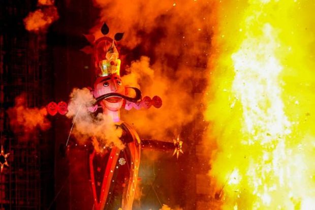 Demon King Ravana stuffed with firecrackers burns during Dussehra celebrations, at Dwarka in New Delhi. (Photo: PTI)