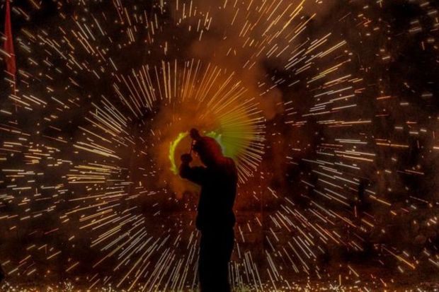 A man lights firecrackers during Dussehra festival in Srinagar, Indian controlled Kashmir, Tuesday, Oct 24, 2023. Dussehra commemorates the triumph of Hindu god Rama over the demon king Ravana, marking the victory of good over evil. (Photo: AP)