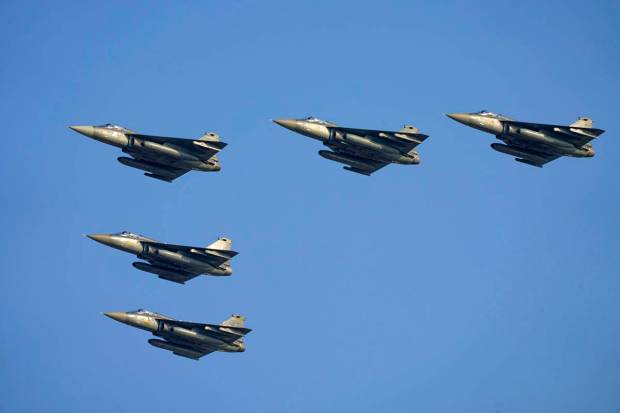 Indian Air Force fighter jets MIG-21 fly past during Air Force Day celebrations at Sangam, the holy confluence of river Ganga, Yamuna and the mythical Saraswati, in Prayagraj. (AP Photo)