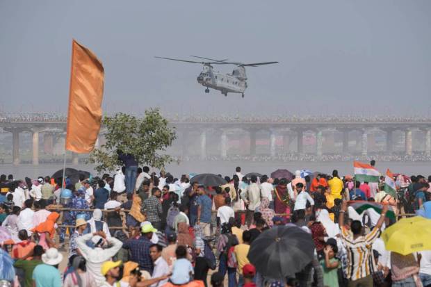 An IAF Chinook helicopter flies during Air Force Day celebrations at Sangam, the holy confluence of river Ganga, Yamuna and the mythical Saraswati, in Prayagraj. (AP Photo)