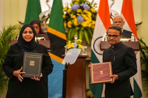 Tanzanian High Commissioner in India Anisa Kapufi Mbega and Indian High Commissioner in Tanzania Binaya Srikanta Pradhan exchange agreements signed by PM Modi and President Hassan. (PTI)