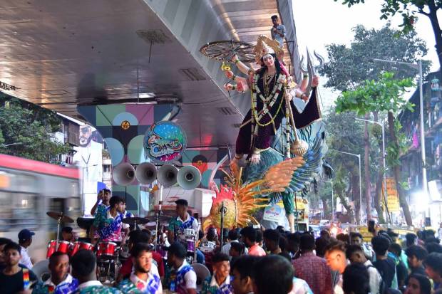 Devotees carry an idol of Goddess Durga idol to a pandal ahead of the Durga Puja festival, in Mumbai. (PTI Photo)