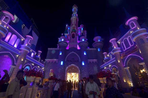 A community puja pandal theming Disney Land in Kolkata. (PTI Photo)