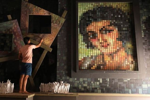 Students of Art College and labours working for makeshift pandal for Durga Puja of Jagat Mukherjee Park in North Kolkata focusing on 