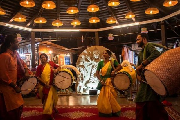 Traditional Women drummer perform at Delhi Haat, ahead of Durga Puja in New Delhi on Tuesday, October 10, 2023. Express photo by Pallavi TO