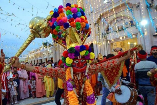 Artists at a religious procession during the Navratri celebrations in Amritsar. (PTI Photo)