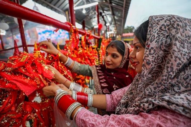 Devotees offer prayers at Kali Mata temple during the ongoing Navratri festival, in Jammu. (PTI Photo)