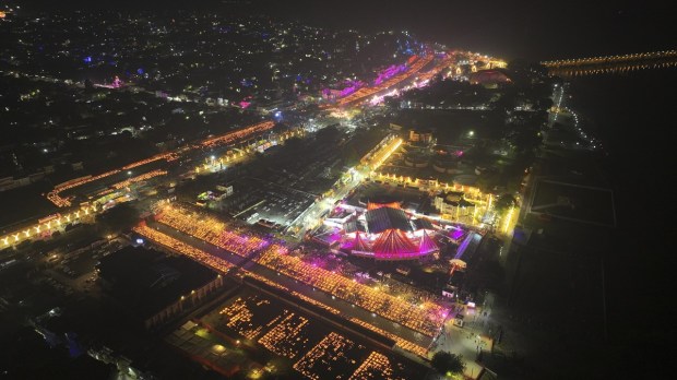 Lamps light up the banks of the river Saryu on the eve of Diwali, in Ayodhya. (AP Photo)