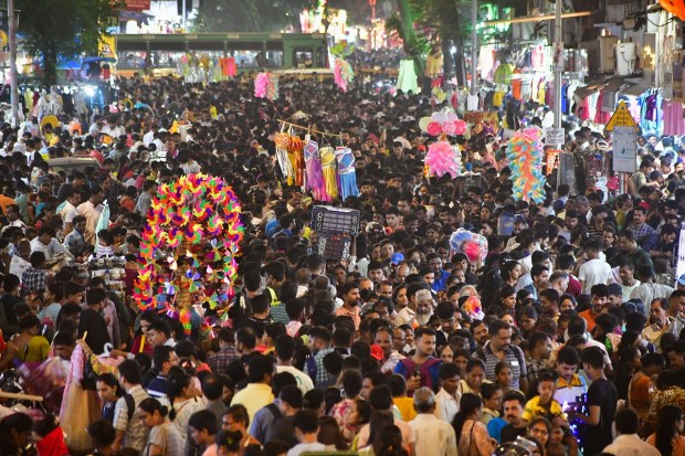 People shop at Dadar market for Diwali festival, in Mumbai. (PTI Photo)
