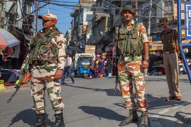 Security personnel stand guard at a market ahead of Diwali festival, a day after an improvised explosive device (IED), fitted inside a tiffin box, was found lying near a police check-point, in Jammu & Kashmir. (PTI Photo)